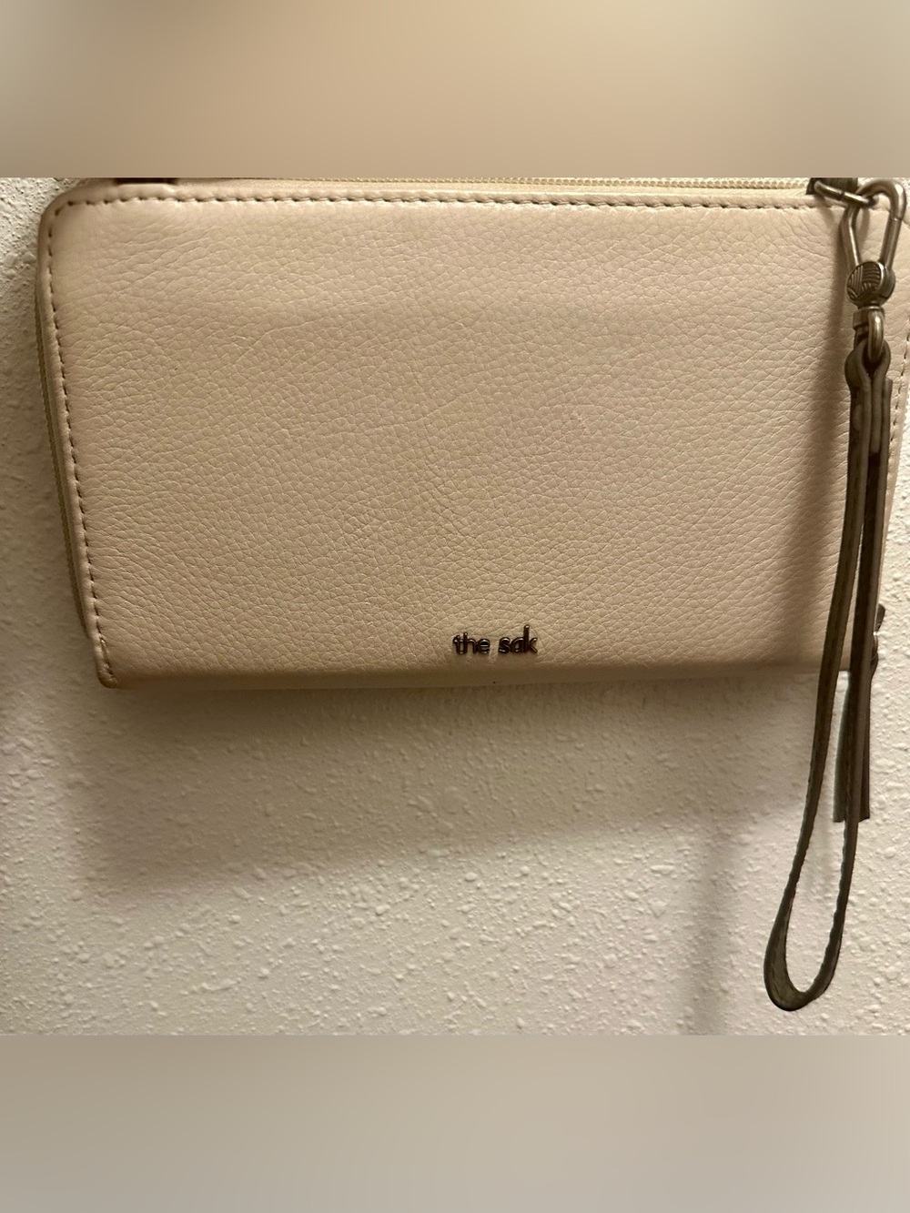 The Sak Cream Pebble Leather Wristlet